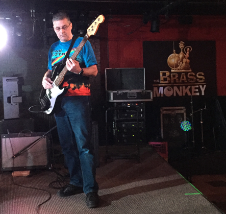 A full length view of Scott playing bass guitar at the Brass Monkey on November 30th, 2016.